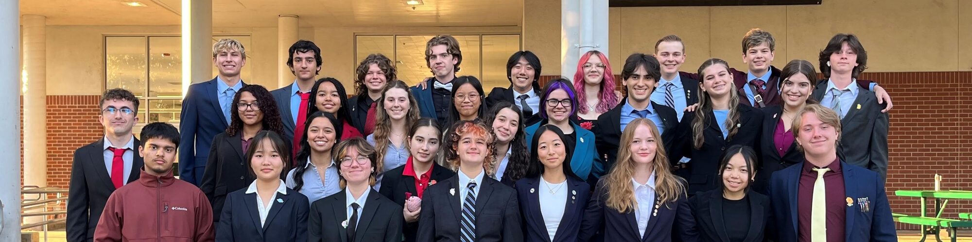 Members of the Speech & Debate team in business attire